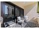 Balcony with outdoor seating and a decorative rug, offering views of the water and surrounding area at 120 1St E St # 109, Tierra Verde, FL 33715