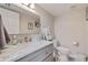 A bright and modern bathroom with a marble countertop, stylish fixtures, and neutral decor at 120 1St E St # 109, Tierra Verde, FL 33715