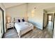 Bright bedroom featuring wood-look floors, stylish coastal decor, and a comfortable, inviting atmosphere at 120 1St E St # 109, Tierra Verde, FL 33715