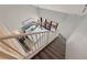Top-down bedroom view features a queen bed, balcony, ceiling fan, and stairs leading from above at 120 1St E St # 109, Tierra Verde, FL 33715