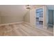 Bonus room featuring luxury vinyl plank flooring, barn door to storage space, and neutral paint at 120 1St E St # 109, Tierra Verde, FL 33715