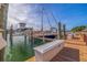 View of the boat docks along the harbor featuring multiple boats, including a sailboat and powerboat at 120 1St E St # 109, Tierra Verde, FL 33715