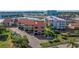 Beautiful waterfront condo building featuring a tile roof and lush landscaping, near the marina at 120 1St E St # 109, Tierra Verde, FL 33715