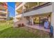 Apartment complex with balconies and a spiral staircase to the ground floor at 120 1St E St # 109, Tierra Verde, FL 33715