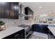 Updated kitchen with dark wood cabinets, white countertops, stainless steel appliances and stylish backsplash at 120 1St E St # 109, Tierra Verde, FL 33715