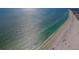 Breathtaking aerial view of the beach with plenty of space for beachgoers at 13303 Gulf Ln, Madeira Beach, FL 33708