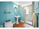 Charming bathroom with pedestal sink, decorative mirror, and walk-in shower at 13303 Gulf Ln, Madeira Beach, FL 33708