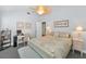 Comfortable bedroom featuring a workstation, ceiling fan and a relaxing color scheme at 13303 Gulf Ln, Madeira Beach, FL 33708