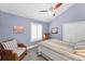 Cozy bedroom with vaulted ceiling and comfortable seating with a beach-themed decor at 13303 Gulf Ln, Madeira Beach, FL 33708