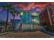 Charming multi-story beach house with balconies and a two-car garage at 13303 Gulf Ln, Madeira Beach, FL 33708