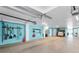 Spacious garage with blue walls, white ceiling, and multiple doors and storage spaces at 13303 Gulf Ln, Madeira Beach, FL 33708