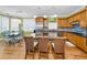 Bright kitchen featuring hardwood floors, a center island, stainless appliances, and ocean views at 13303 Gulf Ln, Madeira Beach, FL 33708