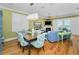 Open-concept living room featuring a fireplace, hardwood floors, and ocean views at 13303 Gulf Ln, Madeira Beach, FL 33708