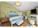 Cozy main bedroom with vaulted ceilings, a ceiling fan, and a painted wood bed frame at 13303 Gulf Ln, Madeira Beach, FL 33708