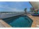 Sparkling pool with an ocean view and a spiral staircase for easy access at 13303 Gulf Ln, Madeira Beach, FL 33708
