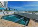 Beautiful pool with beach view and pristine white fence for privacy and safety at 13303 Gulf Ln, Madeira Beach, FL 33708