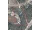 Aerial view showing the lot lines, wooded area and the surrounding area at 13334 Oldenburg Dr, Hudson, FL 34667