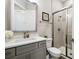 Modern bathroom with a marble vanity, a glass-enclosed shower, and stylish fixtures at 13334 Oldenburg Dr, Hudson, FL 34667