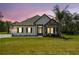 Charming single-story home featuring stone accents, a well-manicured lawn, and a welcoming entrance at 13334 Oldenburg Dr, Hudson, FL 34667