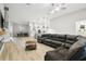 Light-filled living area seamlessly connects to a modern kitchen and dining space for easy living at 13334 Oldenburg Dr, Hudson, FL 34667