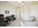 Spacious home office with natural light, neutral walls, and a comfortable seating area at 13334 Oldenburg Dr, Hudson, FL 34667