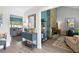 Welcoming hallway featuring stylish decor, leading to a bright living space with comfortable furniture at 13810 Lake Village Pl, Tampa, FL 33618