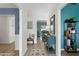 Stylish hallway featuring unique decor leading to a bright living area with comfortable seating at 13810 Lake Village Pl, Tampa, FL 33618