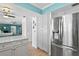 Bright kitchen with stainless steel appliances, a tile backsplash and modern cabinets at 13810 Lake Village Pl, Tampa, FL 33618