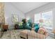 Comfortable living room featuring bright furniture and a beautiful shuttered window at 13810 Lake Village Pl, Tampa, FL 33618