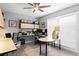 Well-lit office space with gray walls, multiple desks, and plentiful storage at 13810 Lake Village Pl, Tampa, FL 33618