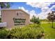 Carrollwood Village Park sign with lush landscaping and blue skies, promoting community and outdoor recreation at 13810 Lake Village Pl, Tampa, FL 33618