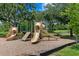Well-maintained community playground with slides, climbing wall, and picnic table for Gathering fun and recreation at 13810 Lake Village Pl, Tampa, FL 33618