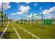 Vibrant community playground with modern equipment and synthetic turf, perfect for outdoor fitness and play at 13810 Lake Village Pl, Tampa, FL 33618