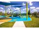 Colorful playground with climbing structures, slides, and shade sails, offering a fun and engaging space for  at 13810 Lake Village Pl, Tampa, FL 33618