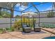 Screened-in pool area with lounge chairs and landscaping at 13810 Lake Village Pl, Tampa, FL 33618