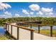 Scenic walking path over the water, offering a tranquil experience and a connection with nature at 13810 Lake Village Pl, Tampa, FL 33618
