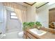 Bathroom with a shower-tub combination, vanity, and classic fixtures at 13903 Wolcott Dr, Tampa, FL 33624