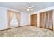 Bedroom with two louvered closets and large window providing natural light at 13903 Wolcott Dr, Tampa, FL 33624