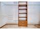 Spacious walk-in closet featuring built-in shelving and ample storage options at 13903 Wolcott Dr, Tampa, FL 33624