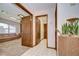 Tiled hallway with multiple entryways, and decorative elements at 13903 Wolcott Dr, Tampa, FL 33624
