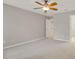 Bedroom with carpet, ceiling fan and neutral paint with access to closet at 16137 Churchview Dr, Lithia, FL 33547