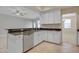 Kitchen featuring granite countertops, white cabinetry, and tiled floor at 16137 Churchview Dr, Lithia, FL 33547