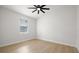 Neutral bedroom with light wood floors, ceiling fan, and a window at 1625 39Th S St, St Petersburg, FL 33711