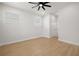 Minimalist bedroom with hardwood floors, neutral paint, and natural light from windows at 1625 39Th S St, St Petersburg, FL 33711