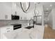 Sleek kitchen featuring stainless steel appliances, marble countertops, and modern fixtures at 1625 39Th S St, St Petersburg, FL 33711