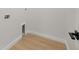 Laundry room featuring light wood floors and white walls at 1625 39Th S St, St Petersburg, FL 33711