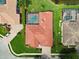 A bird's-eye view captures the home, highlighting its red tile roof and screened-in pool area at 17923 Arbor Haven Dr, Tampa, FL 33647