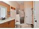 Clean bathroom with granite countertop vanity and a glass enclosed shower at 17923 Arbor Haven Dr, Tampa, FL 33647