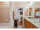 En-suite bathroom with granite countertop and views into adjacent bedroom at 17923 Arbor Haven Dr, Tampa, FL 33647