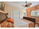 Comfortable bedroom features closet, natural light, and wood floors at 17923 Arbor Haven Dr, Tampa, FL 33647